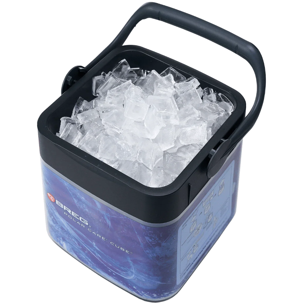 Ice bucket with handle filled with ice cubes on a white background