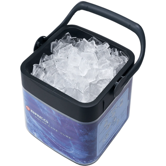 Ice bucket with handle filled with ice cubes on a white background
